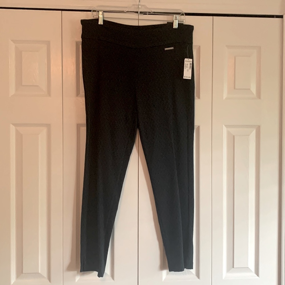 Skinny leg teal and black pattern dress pants.